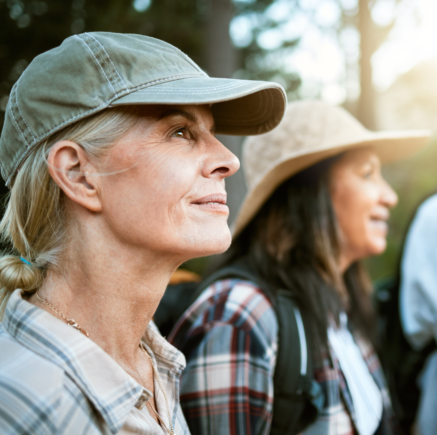 Two women hiking outdoors together, enjoying nature