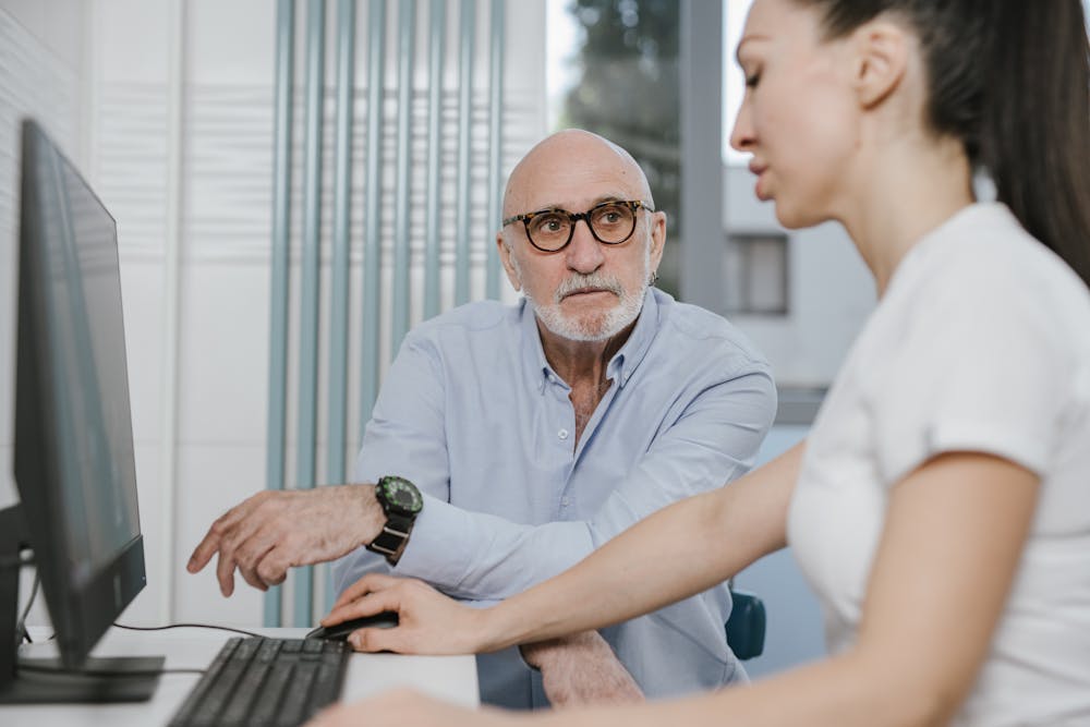 Doctor and senior patient having a warm conversation