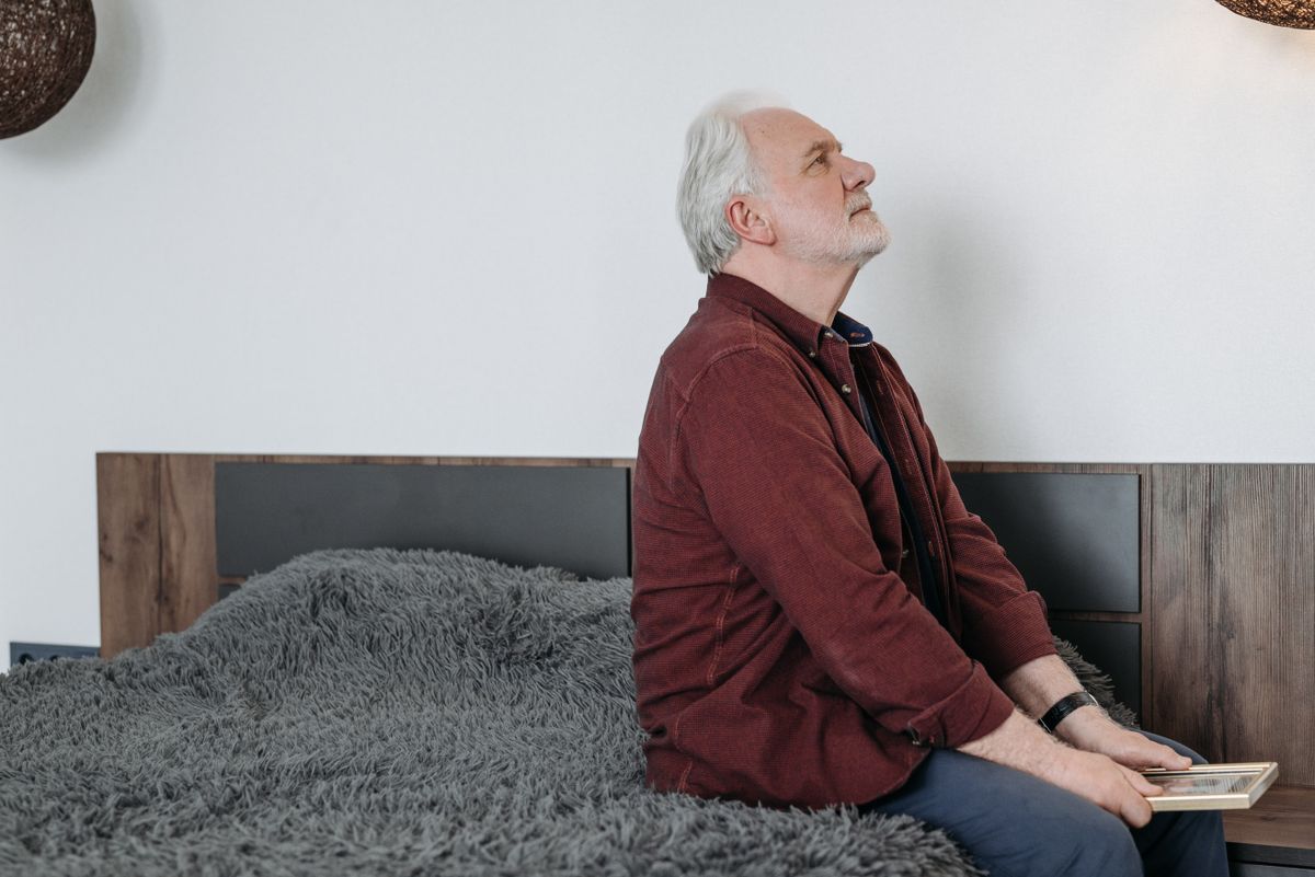 A senior man in quiet reflection